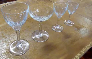 SUITE OF FIFTY CRYSTAL GLASSES AND SIX DECANTERS