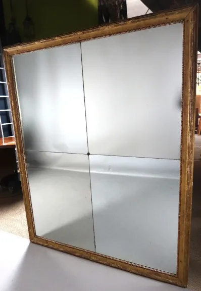 Grand miroir en bois doré fin XVIII début XIX