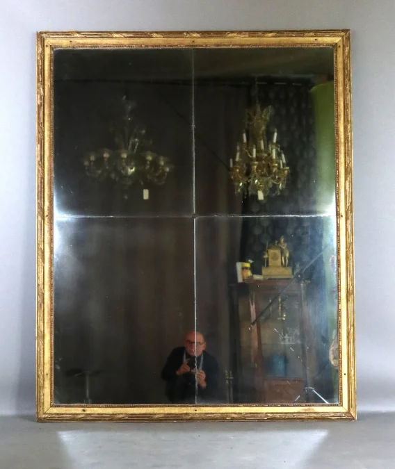 Grand miroir en bois doré fin XVIII début XIX