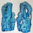 Paire de vases en barbotine avec sculpture perroquets