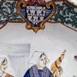 Plat a anses en faïence signée de Malicorne Pouplard Beatrix à décors de Bretons