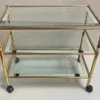 1970′ Desserte a Roulettes en Laiton Doré et Verre Avec Entourage Miroir Maison Jansen