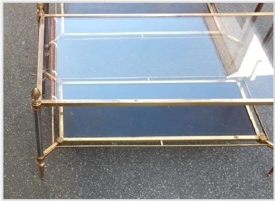 Pair of Maison Jansen Coffee Tables in bronze and brass, with gunmetal patinated uprights—characteristic of the brand.