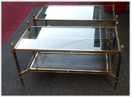 Pair of Maison Jansen Coffee Tables in bronze and brass, with gunmetal patinated uprights—characteristic of the brand.