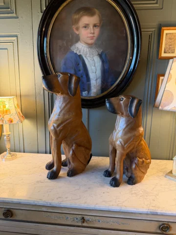 Pair of carved and patinated wood dogs — Very good condition