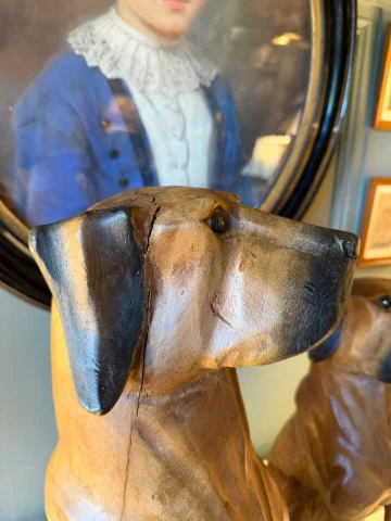 Pair of carved and patinated wood dogs — Very good condition