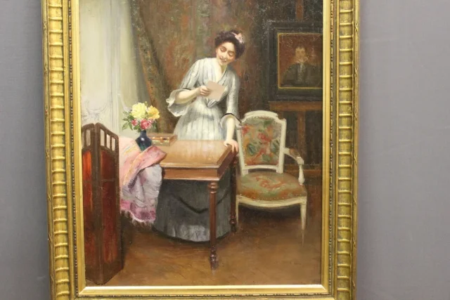 Huile sur toile représentant " la femme à la lettre" par Alfred Martin datée 1904