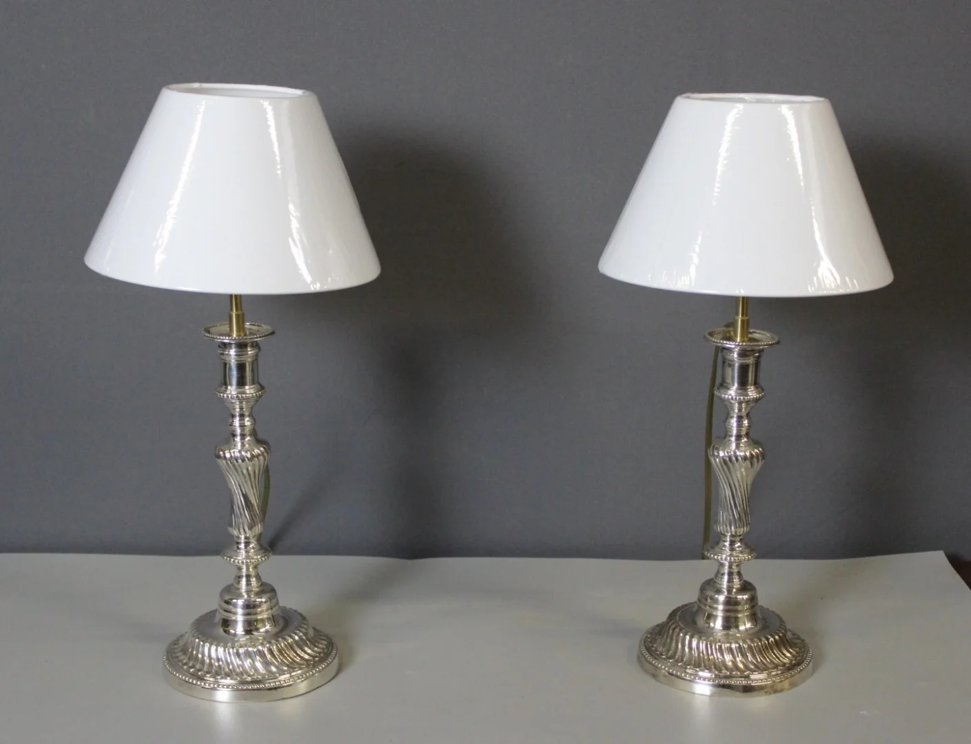 PAIR OF SILVER PLATE LAMPS