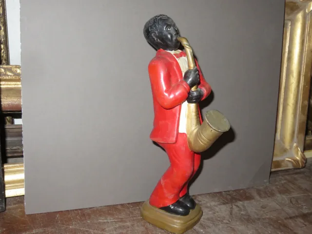 Estatua en porcelana de un músico negro, época 20ème