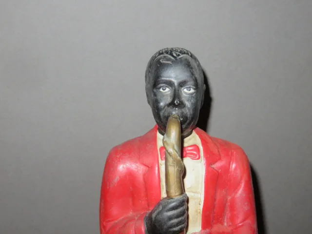 Estatua en porcelana de un músico negro, época 20ème