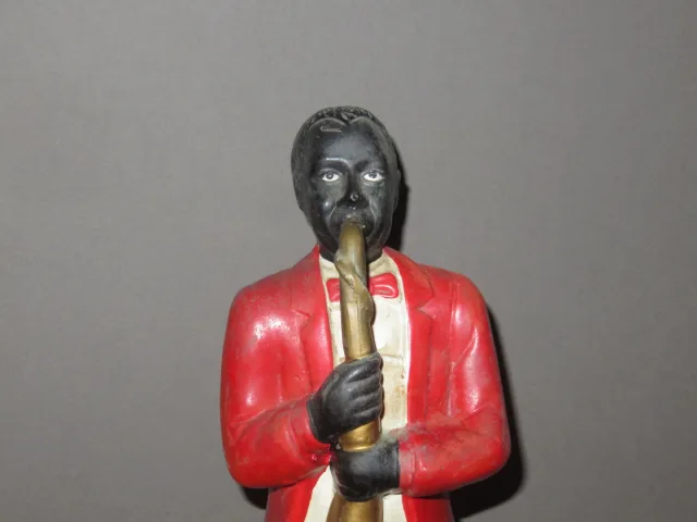 Estatua en porcelana de un músico negro, época 20ème