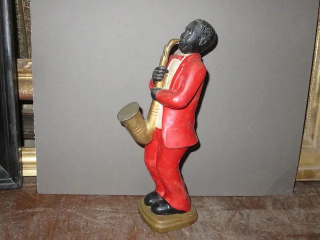 Estatua en porcelana de un músico negro, época 20ème