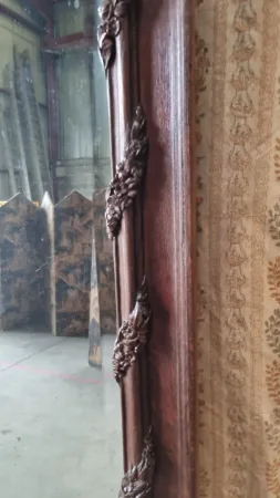 Grand miroir Napoléon III en chêne sculpté