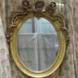 Grand miroir ovale en bois doré époque Napoléon III