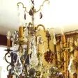 Lustre de forme cage en bronze à décor de fruits en verre de couleur début XXème