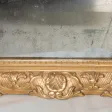 Miroir en bois sculpté et doré début XIXe siècle
