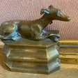 Barres de cheminées aux chiens assis