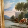 Grande huile sur toile présentant des vaches et leur berger prés d'un plan d'eau