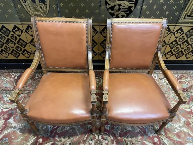 Pair of Louis XVI style leather armchairs