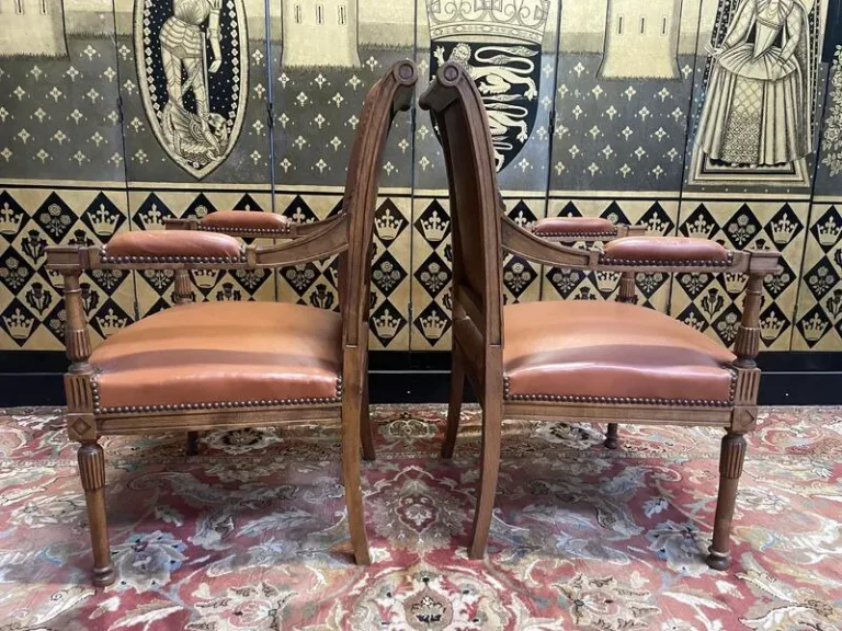 Pair of Louis XVI style leather armchairs
