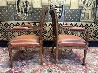 Pair of Louis XVI style leather armchairs