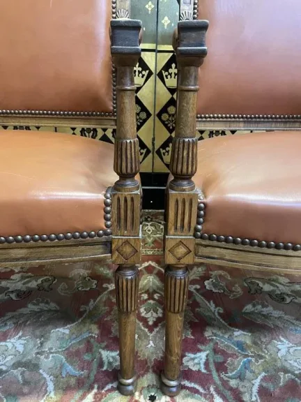 Pair of Louis XVI style leather armchairs