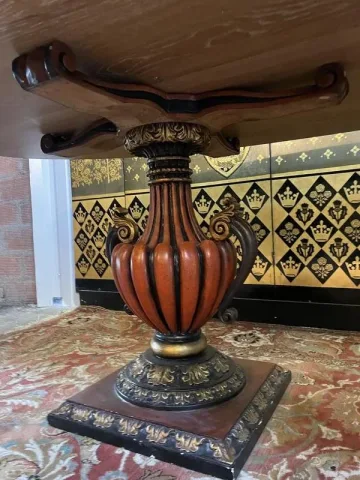 Oval oak dining table with vase legs