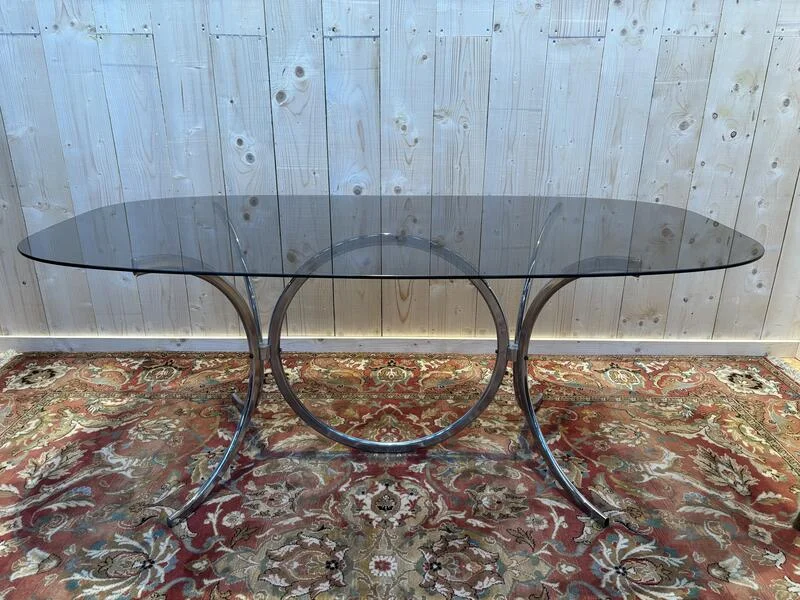Contemporary glass and chrome dining table.