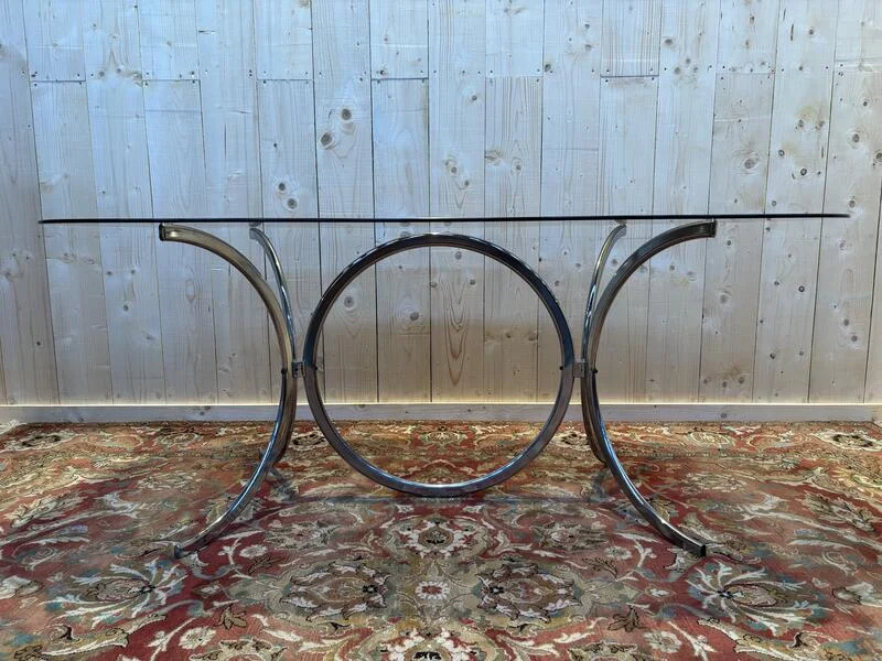 Contemporary glass and chrome dining table.