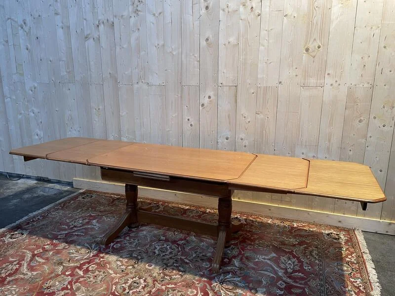 Oak dining table with integrated extensions