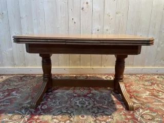 Oak dining table with integrated extensions