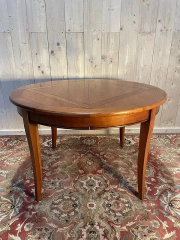 Round cherry wood dining table
