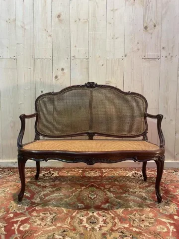 Louis XV mahogany and cane bench