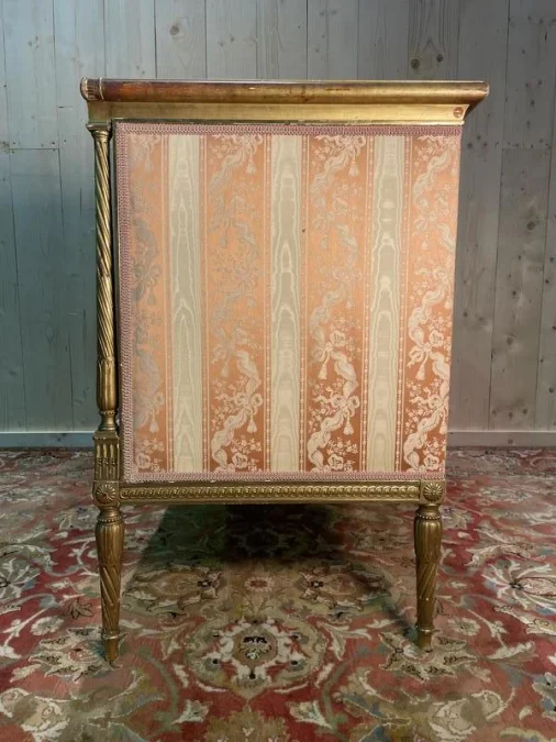 Louis XVI style bench in gilded wood.
