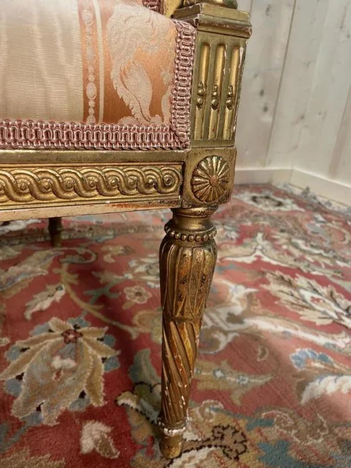 Louis XVI style bench in gilded wood.