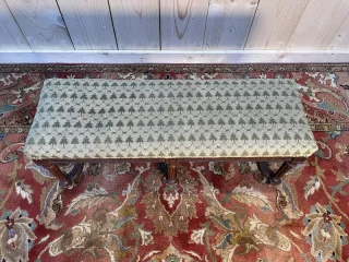 Foot rest in the shape of a Louis XVI style bench