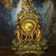 Pendule bronze doré cariatides XIX.