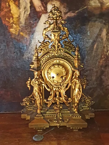 Pendule bronze doré cariatides XIX.