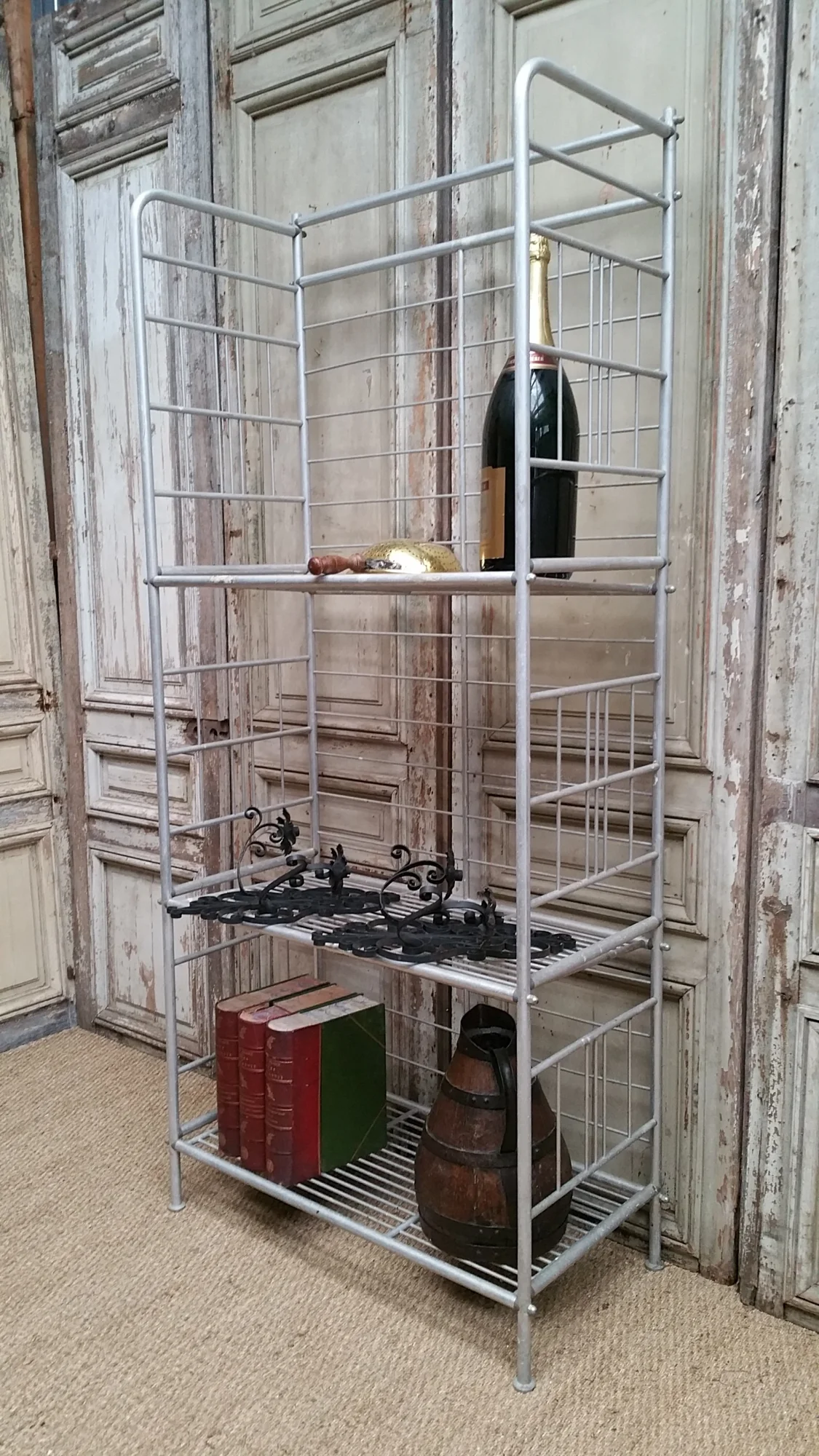 Shelf display stand of vintage, aluminum bakery;