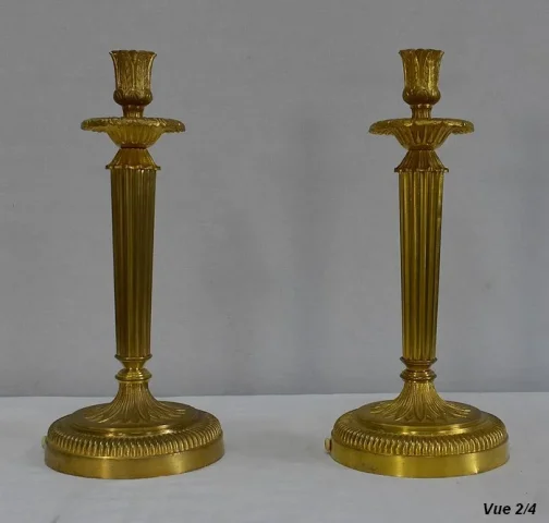 Paire de Flambeaux en Bronze Doré, style Louis XVI – Début XXe