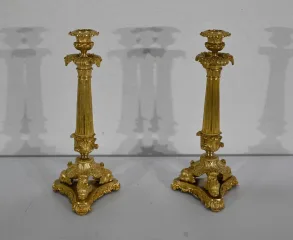 PAIR OF FRENCH RESTAURATION PERIOD CANDLESTICKS