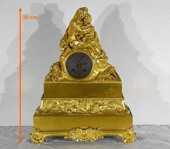 Pendule en Bronze Doré « La Vierge à la Chaise » – 1ère partie XIXe