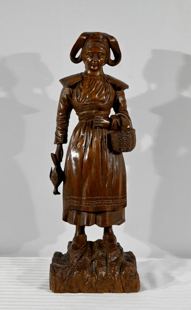 WOODEN STATUE OF A BRETON