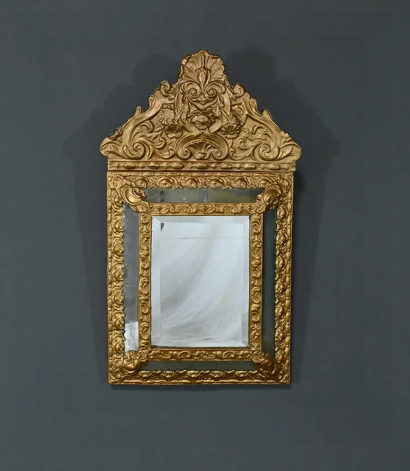 MIRROR IN REPOUSSE BRASS
