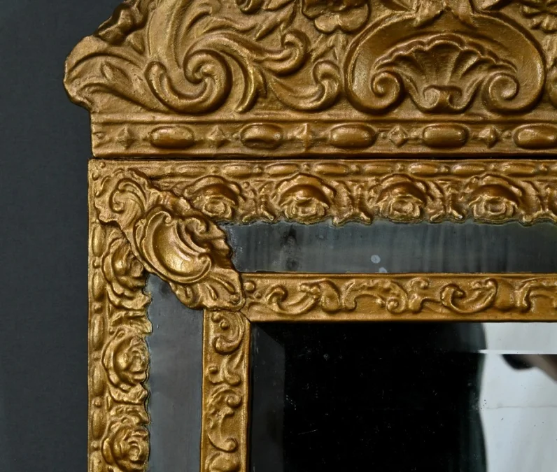 MIRROR IN REPOUSSE BRASS