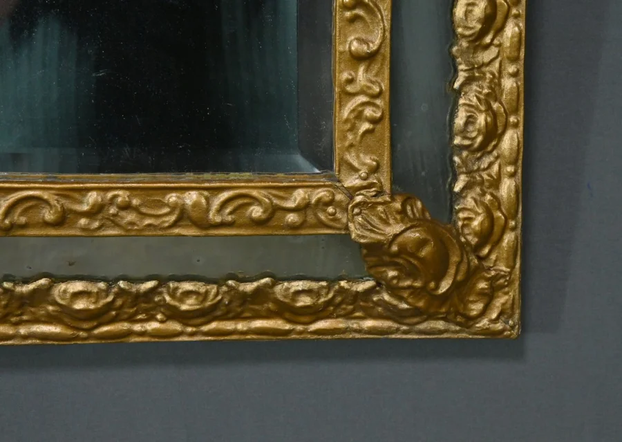 MIRROR IN REPOUSSE BRASS
