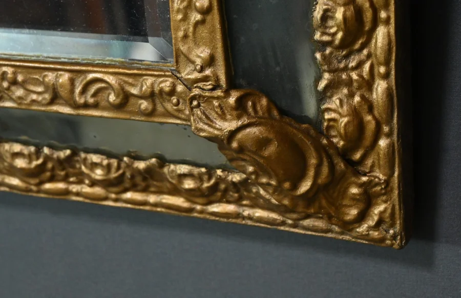 MIRROR IN REPOUSSE BRASS