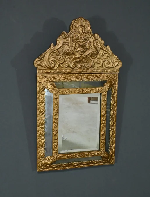 MIRROR IN REPOUSSE BRASS