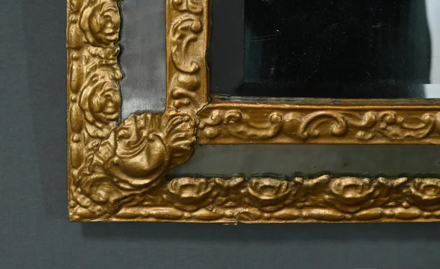 MIRROR IN REPOUSSE BRASS