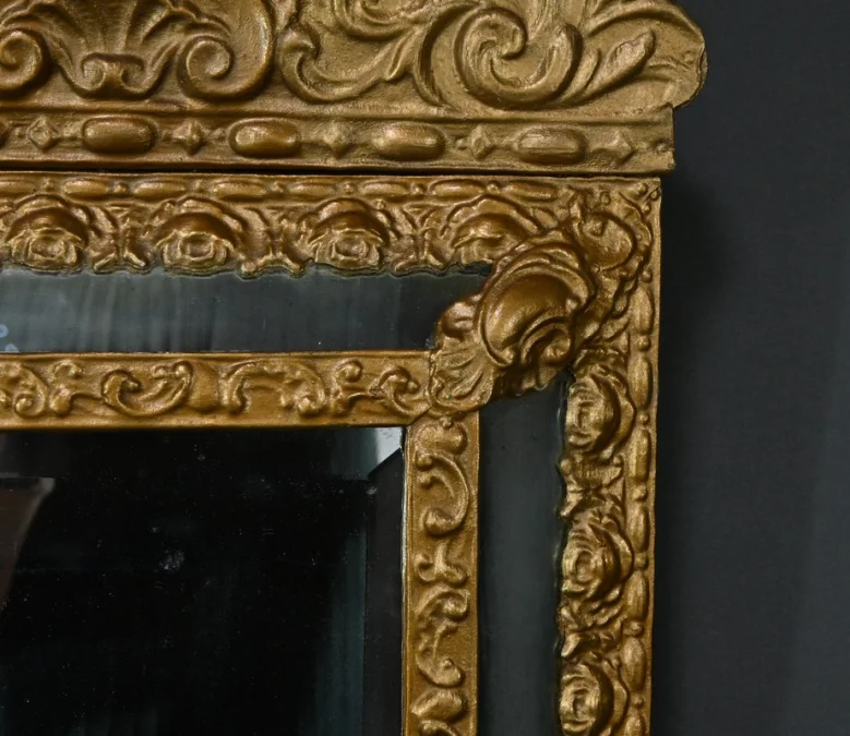 MIRROR IN REPOUSSE BRASS